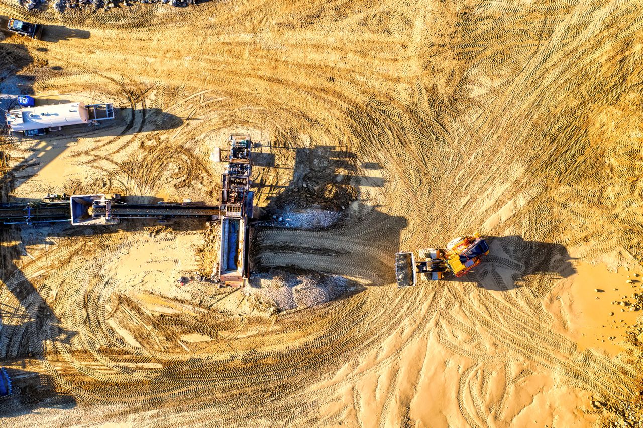 Services Drone shot of an industrial construction site with vehicles and machinery in Rochester, MN.